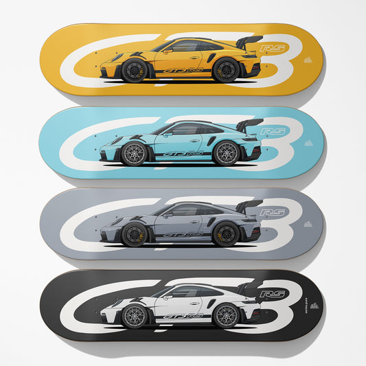 Four car skateboard decks with different colored cars on a white background