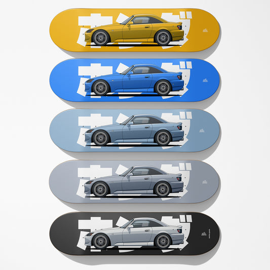 Set of five skateboard decks with different colored cars on each deck.
