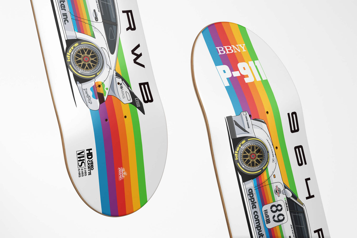 Two rainbow-colored skateboard decks with car graphics and text on a white background