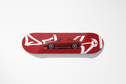 Red car model on a skateboard deck