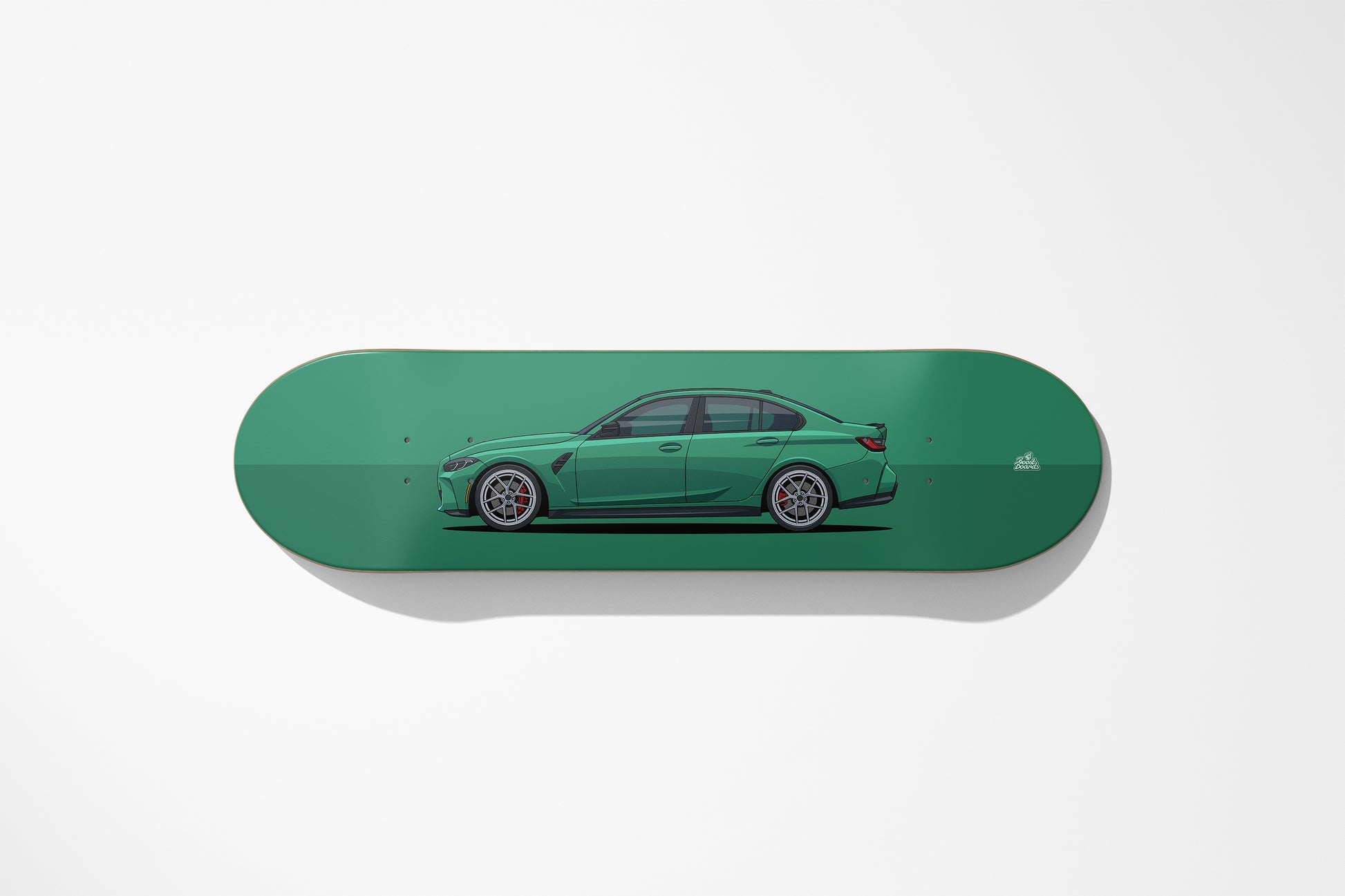 Green skateboard deck with a car design on a white background