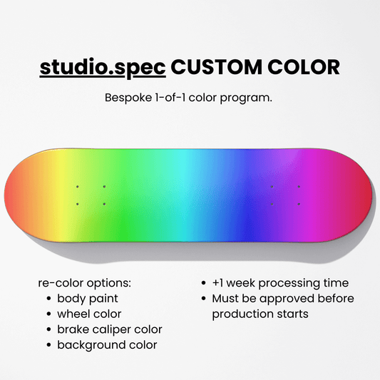 Colorful skateboard deck with text about studio.spec custom color program on a white background