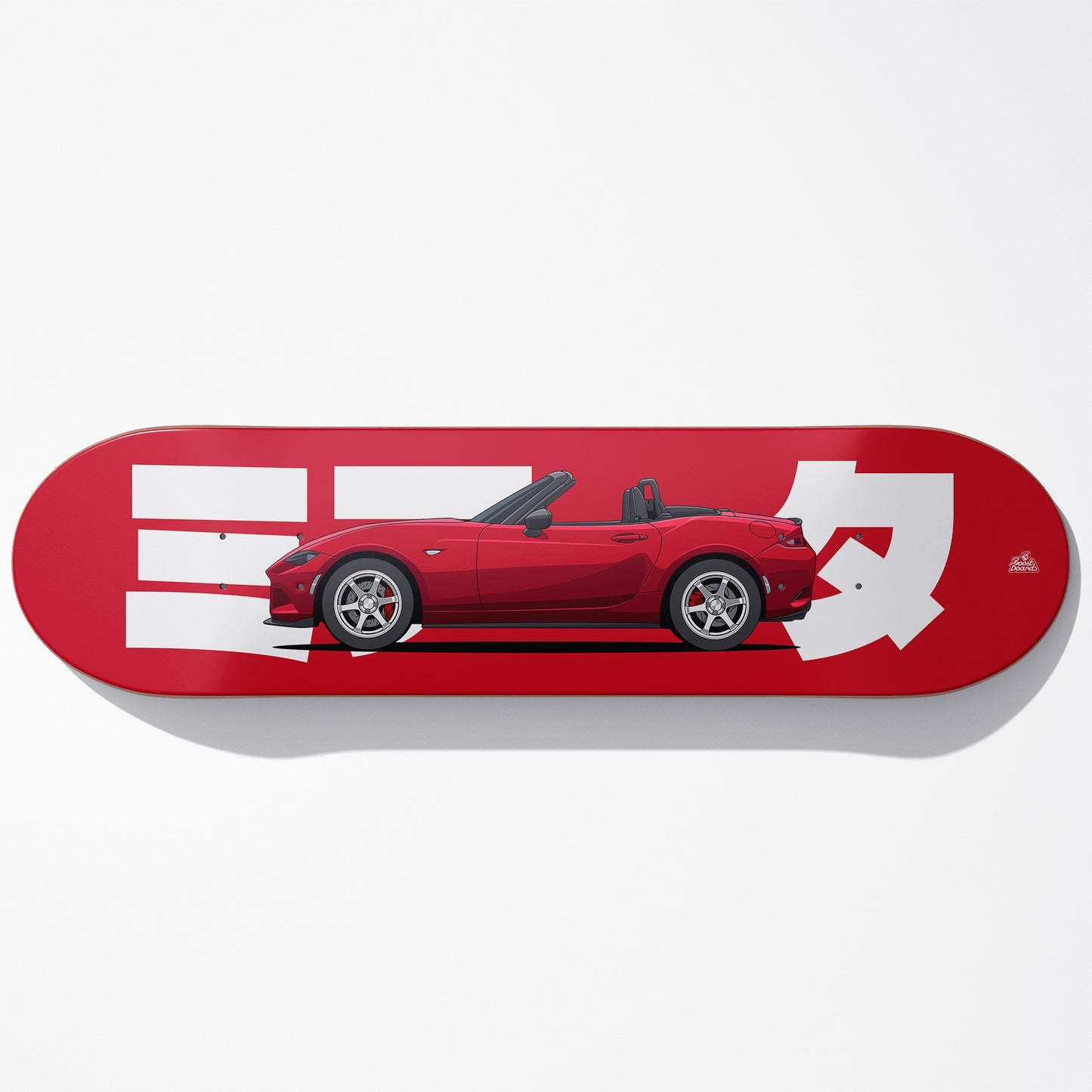 Red skateboard deck with a car illustration and white graphics on a white background