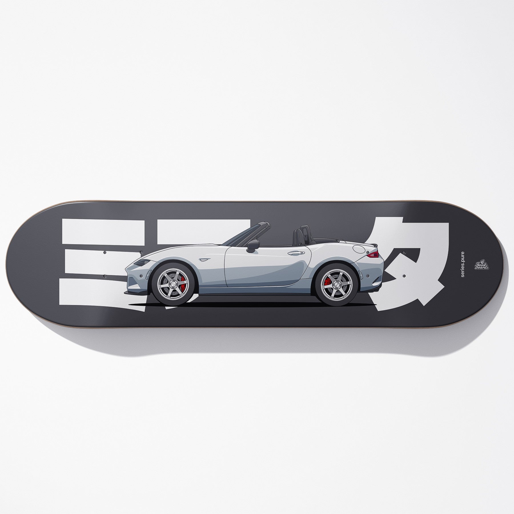 Skateboard deck with a car design and branding on a white background