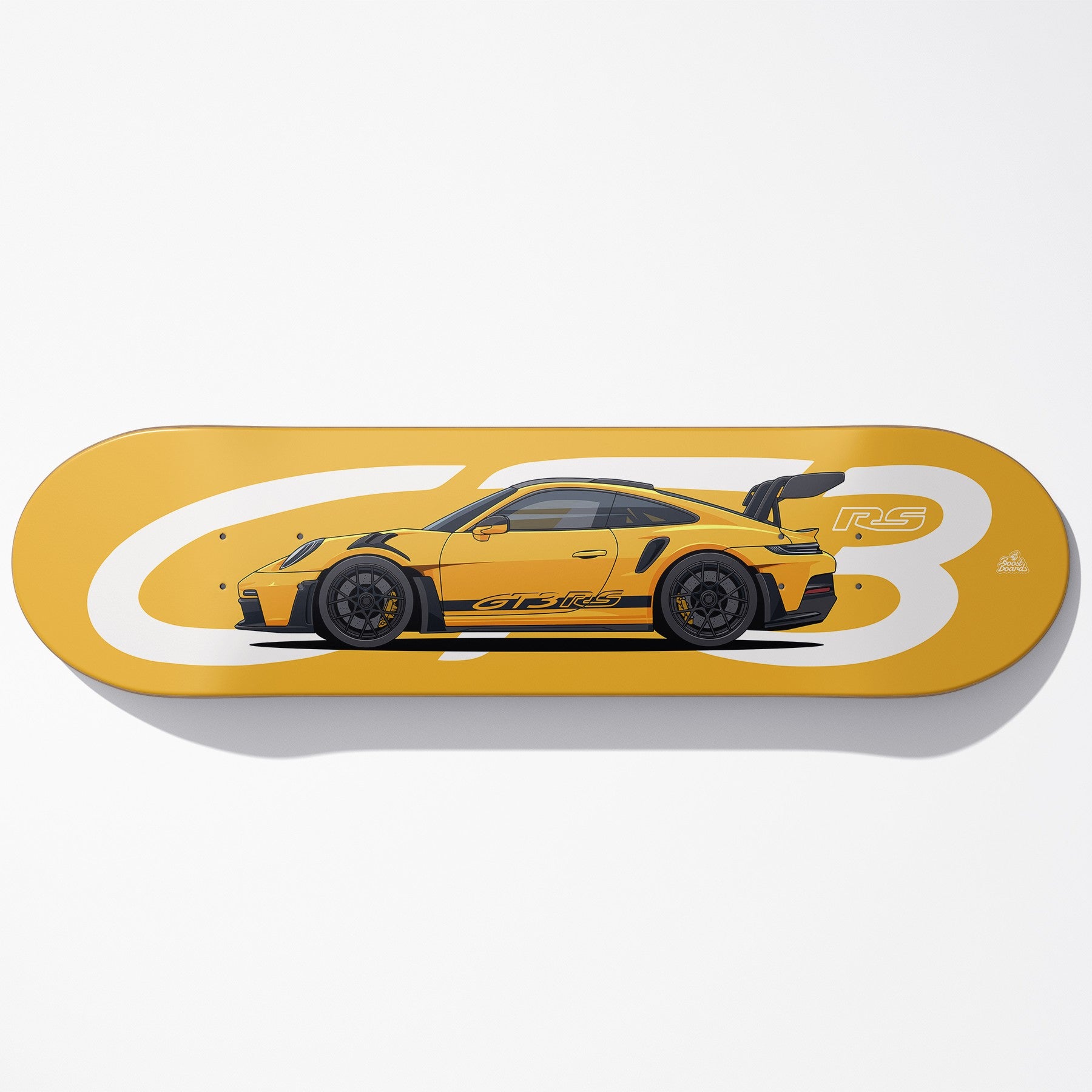 Yellow skateboard deck with a car design on a white background
