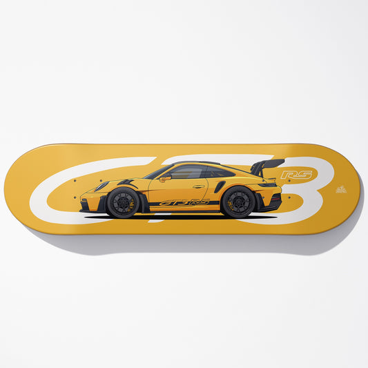 Yellow skateboard deck with a car design on a white background