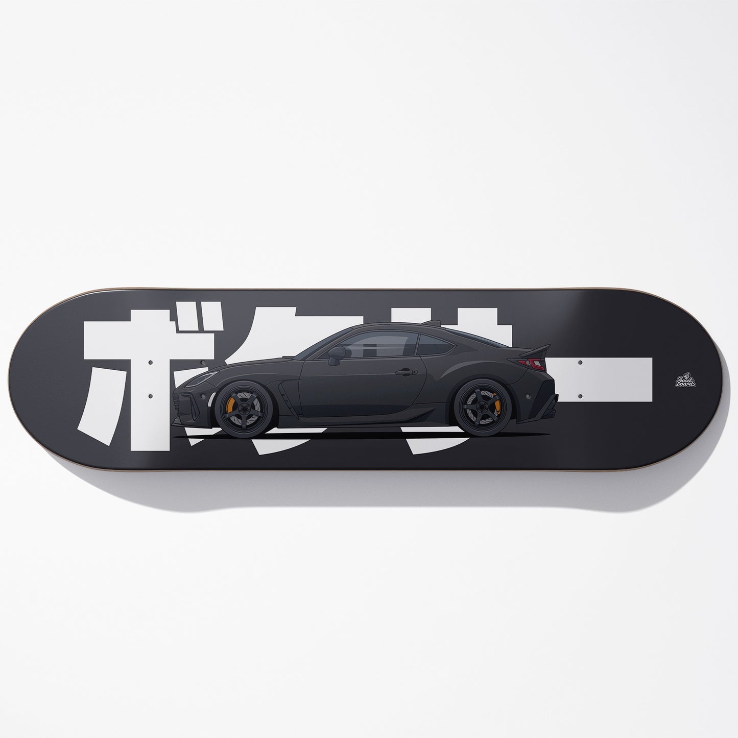Skateboard deck with a black car design and white text on a gray background
